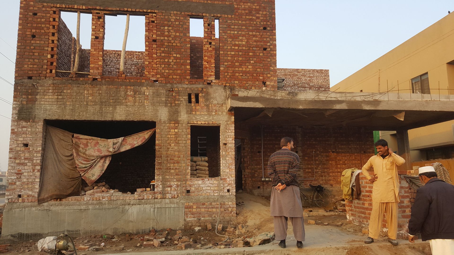 Grey structure under construction by Bunyad Allied