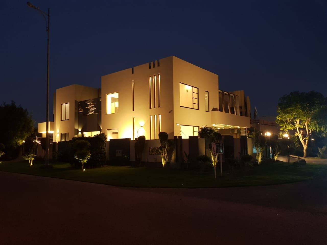 Corner residence at night by Bunyad Allied